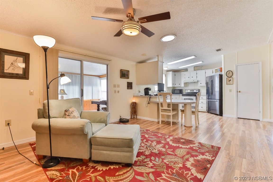 806 Navigators Way Edgewater, FL 32141 - Photo 24 of 59 a living room with furniture and a table