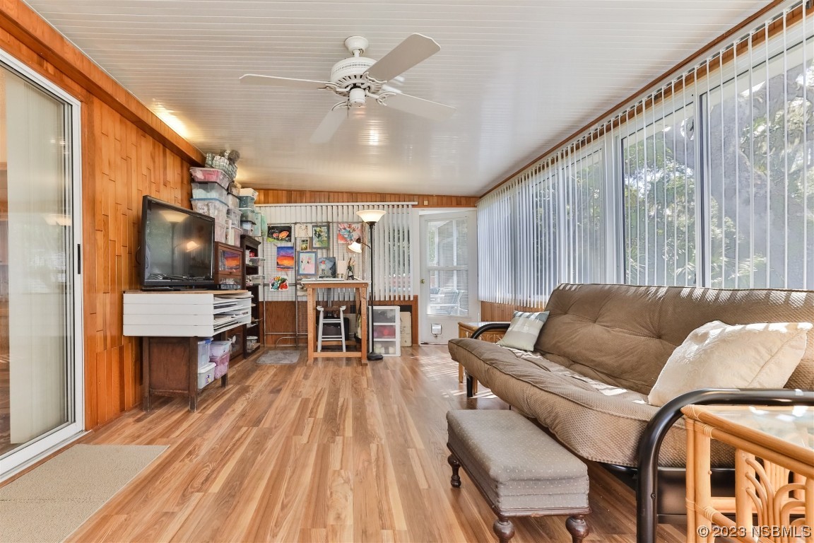 806 Navigators Way Edgewater, FL 32141 - Photo 25 of 59 a living room with furniture and a flat screen tv