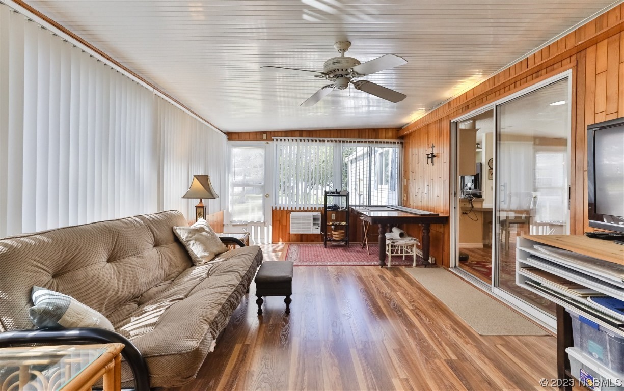 806 Navigators Way Edgewater, FL 32141 - Photo 27 of 59 a living room with furniture and wooden floor