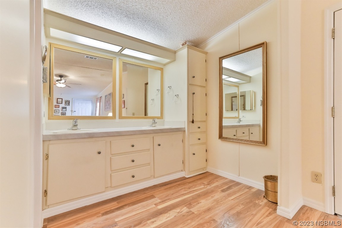 806 Navigators Way Edgewater, FL 32141 - Photo 31 of 59 a spacious bathroom with a granite countertop sink mirror and