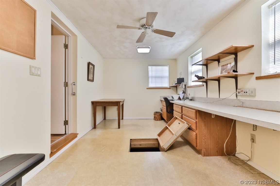 806 Navigators Way Edgewater, FL 32141 - Photo 32 of 59 a room with furniture a ceiling fan and a wooden floor