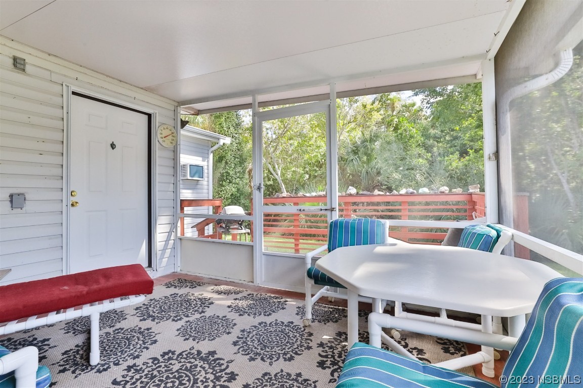 806 Navigators Way Edgewater, FL 32141 - Photo 39 of 59 a view of a dining room with furniture window and outside view