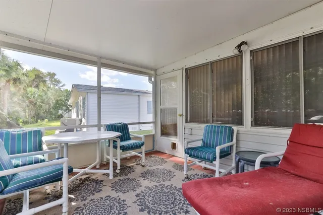 a view of a lake with houses in the back