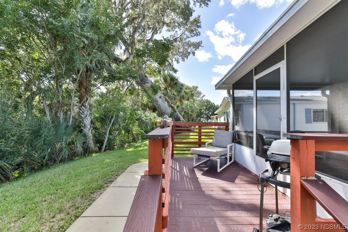 806 Navigators Way Edgewater, FL 32141 - Photo 6 of 59 a view of backyard with outdoor seating and trees