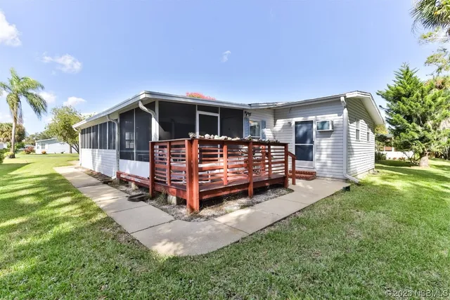 a view of a house with a yard and garage