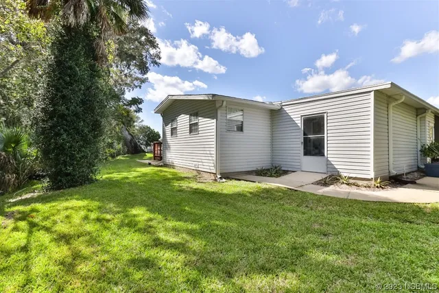 a backyard of a house with lots of green space