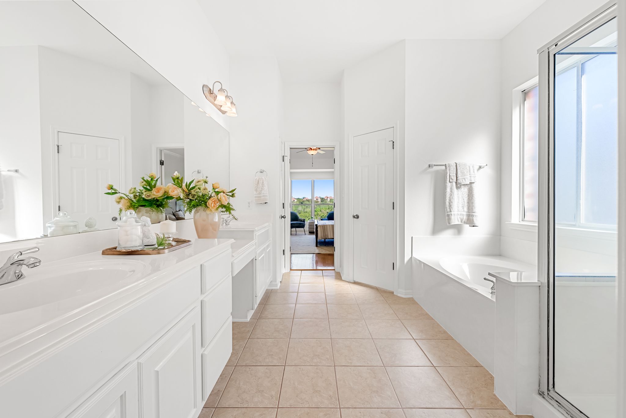 2708 Rio Mesa Drive Austin, TX 78732 - Photo 16 of 40 a bathroom with a sink and a mirror