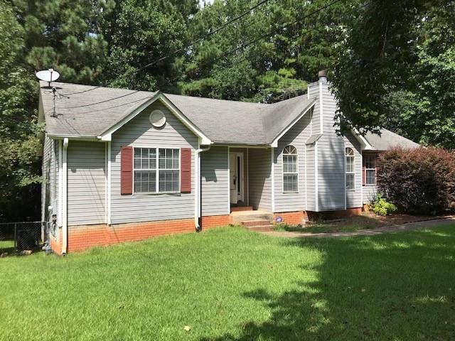 234 Nicki Court Hampton, GA 30228 - Photo 1 of 1 a front view of a house with a yard