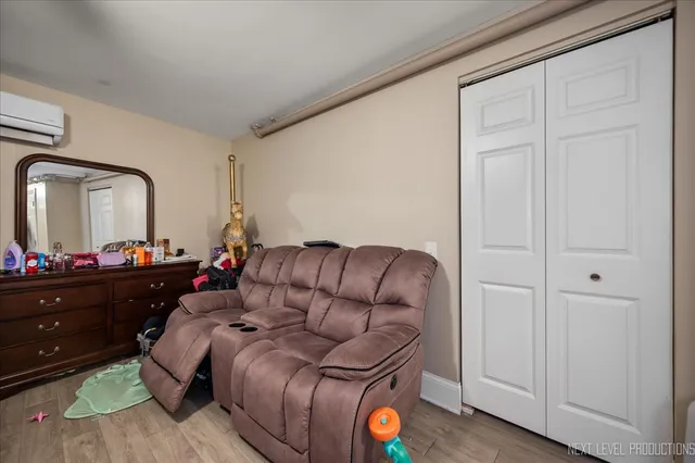 a living room with furniture and a mirror