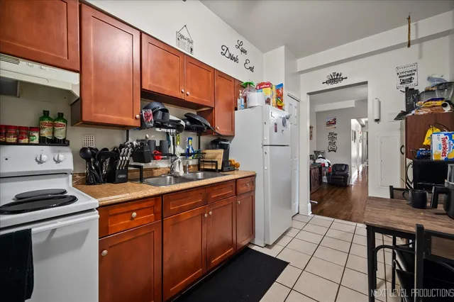 a kitchen with stainless steel appliances a refrigerator and a stove