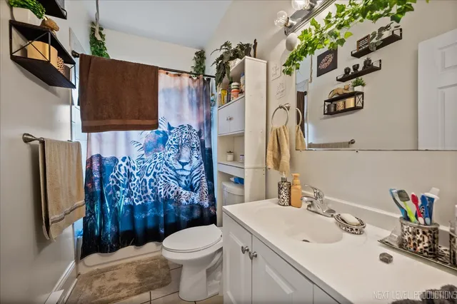 a bed room with a bed and a dresser