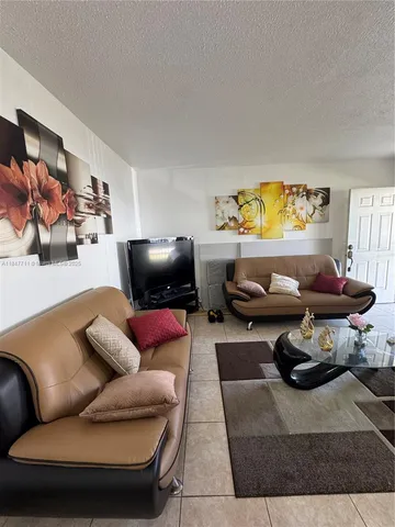 a living room with furniture and a couch