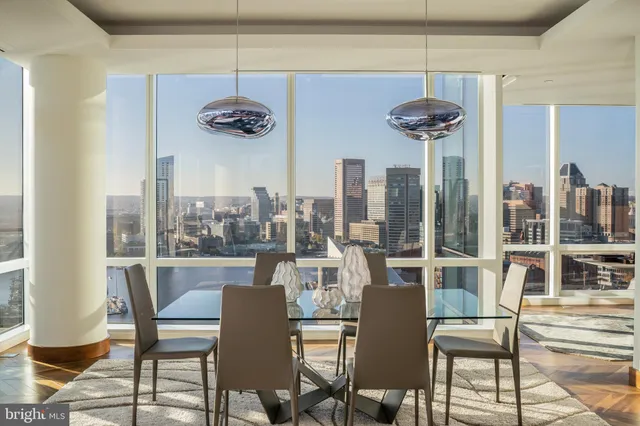 a view of a livingroom with furniture and a large window