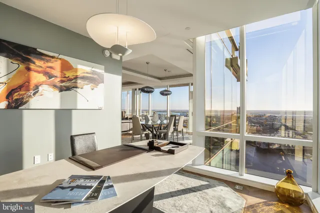 a view of a balcony with two chairs and a table