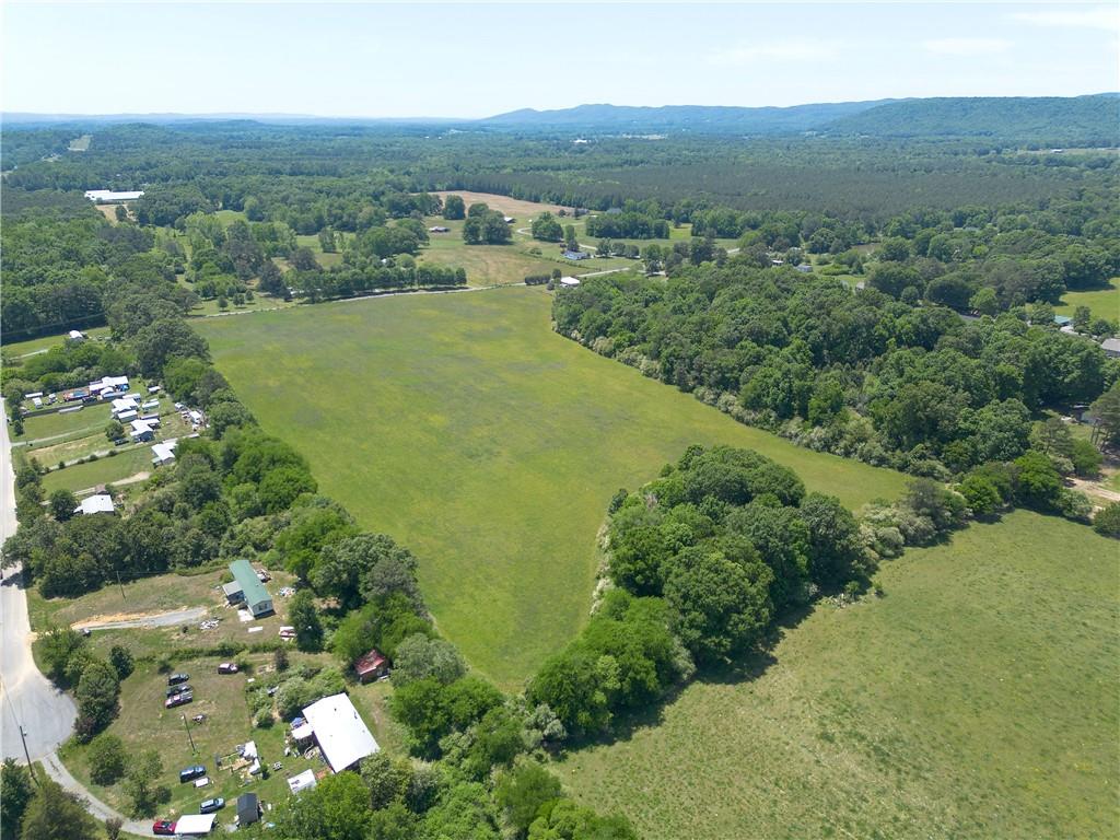 0 Fairview Road Northwest Calhoun, GA 30701 - Photo 8 of 14 an aerial view of green landscape with trees houses and mountain view