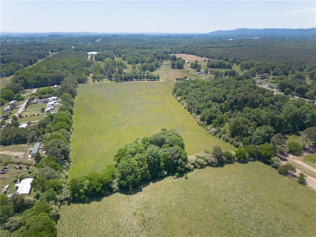 0 Fairview Road Northwest Calhoun, GA 30701 - Photo 9 of 14 an aerial view of green landscape with trees houses and mountain view