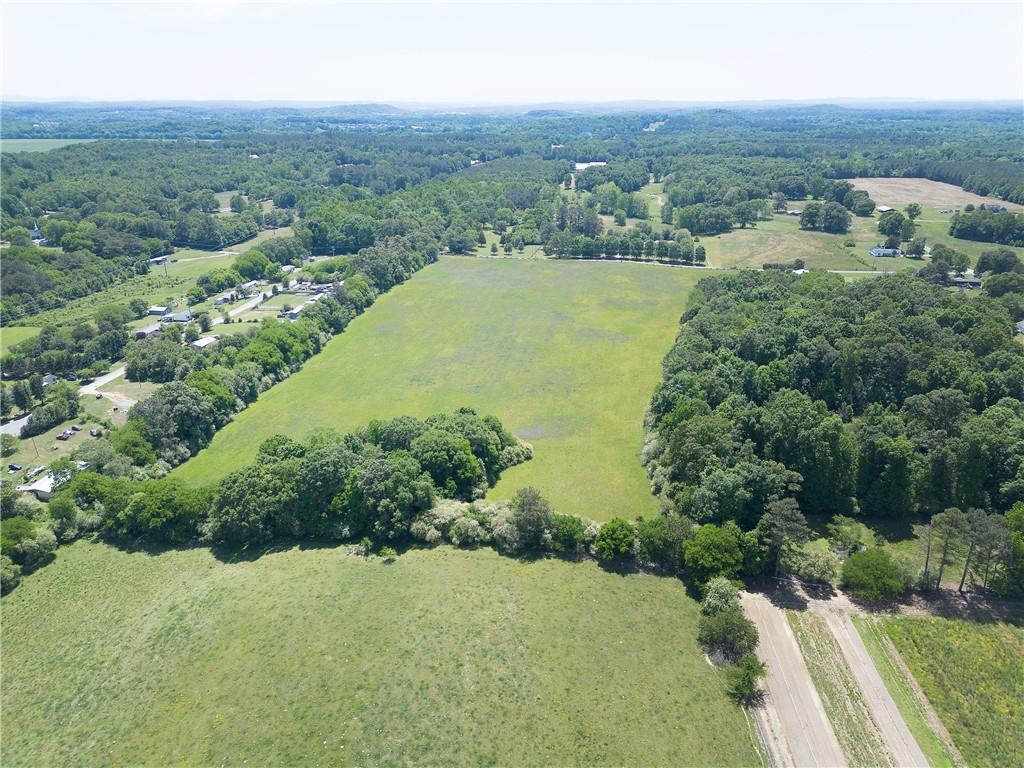 0 Fairview Road Northwest Calhoun, GA 30701 - Photo 10 of 14 an aerial view of green landscape with trees houses and mountain view