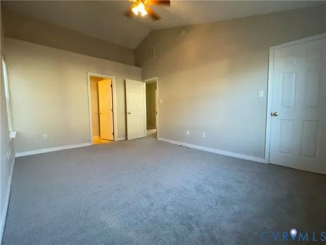a bathroom with a double vanity sink mirror and toilet
