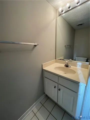 a white toilet sitting next to a shower