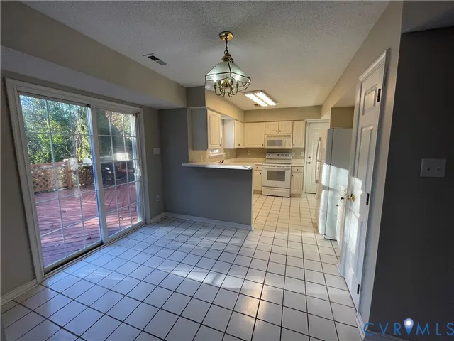 a view of a livingroom with a ceiling fan and window