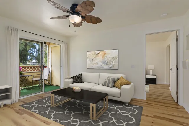 a living room with furniture and a rug