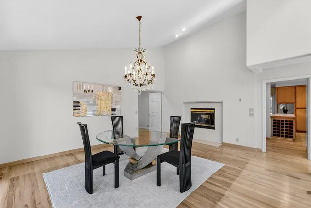 a kitchen that has a sink and a wooden floor