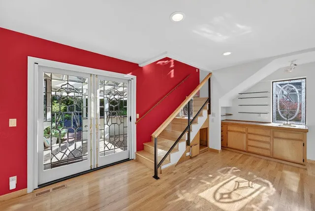 a kitchen with stainless steel appliances granite countertop a sink and a refrigerator