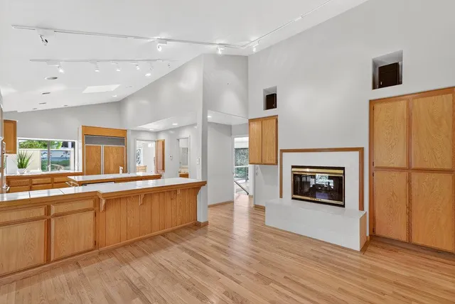 a bedroom with a large bed and a large window