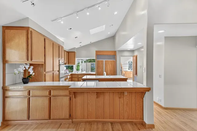 a spacious bedroom with a bed and a large window