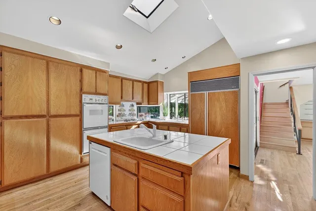 a bed room with a bed and glass door