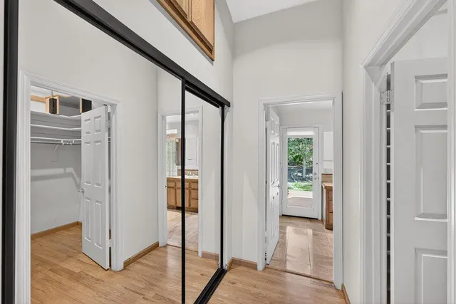 a view of a house with a yard and tree s