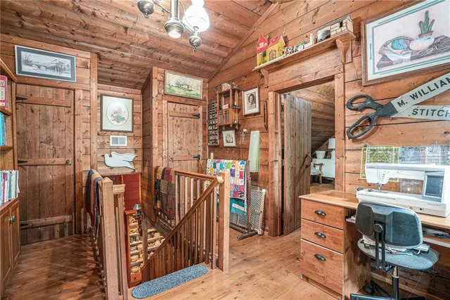 a living room filled with lots of furniture and a table