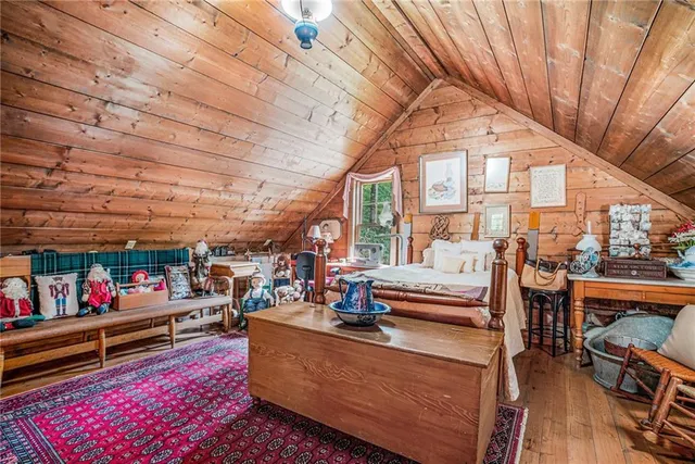 a view of a livingroom with furniture and staircase