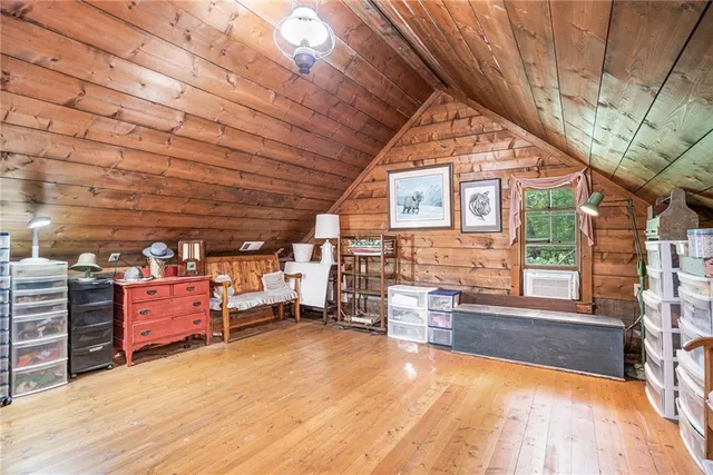 a backyard of a house with barbeque oven table and chairs