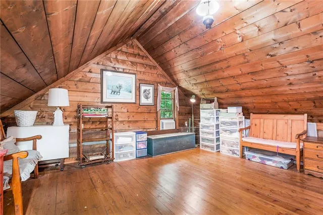 a view of living room with furniture and a fireplace