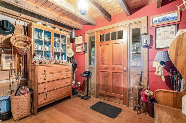 a view of entryway with wooden floor and stairs