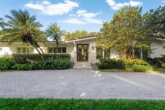 a view of a house with a garden