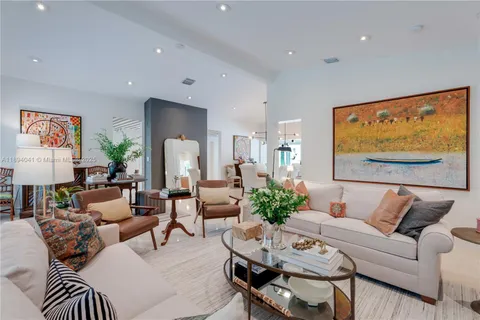 a kitchen with cabinets a sink and appliances