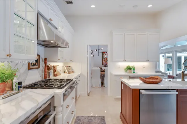 a kitchen with a stove and a refrigerator