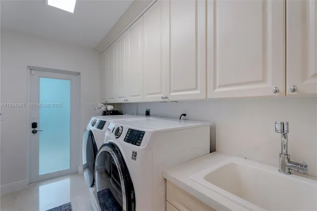 a utility room with dryer and washer
