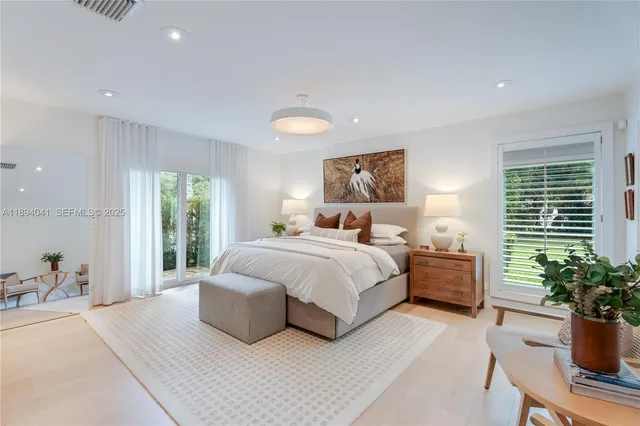 a bedroom with a bed and furniture