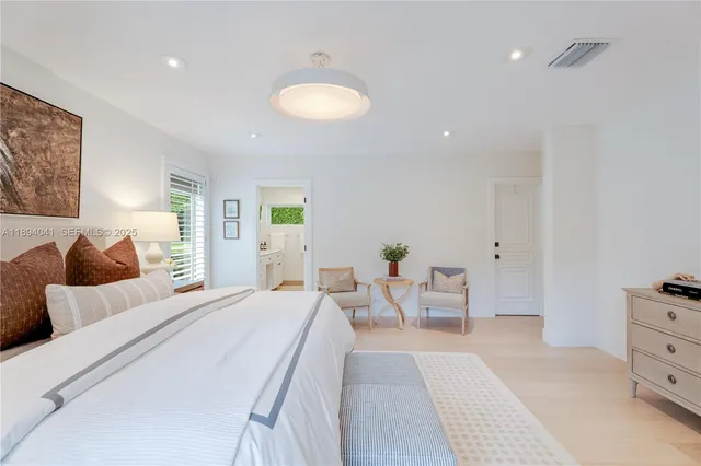 a bedroom with a bed and furniture