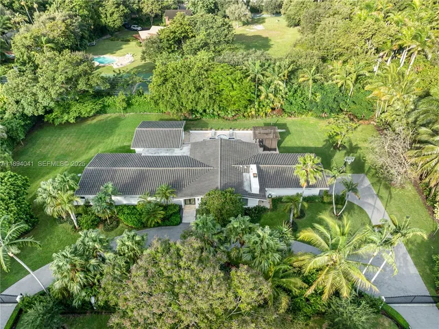 an aerial view of a house with a garden