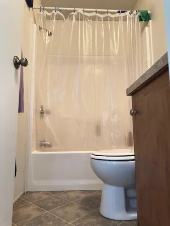 a bed room with a bed and a desk