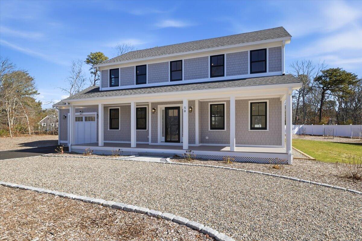 58 Old Chatham Road Brewster, MA 02631 - Photo 1 of 38 a front view of a house with a yard