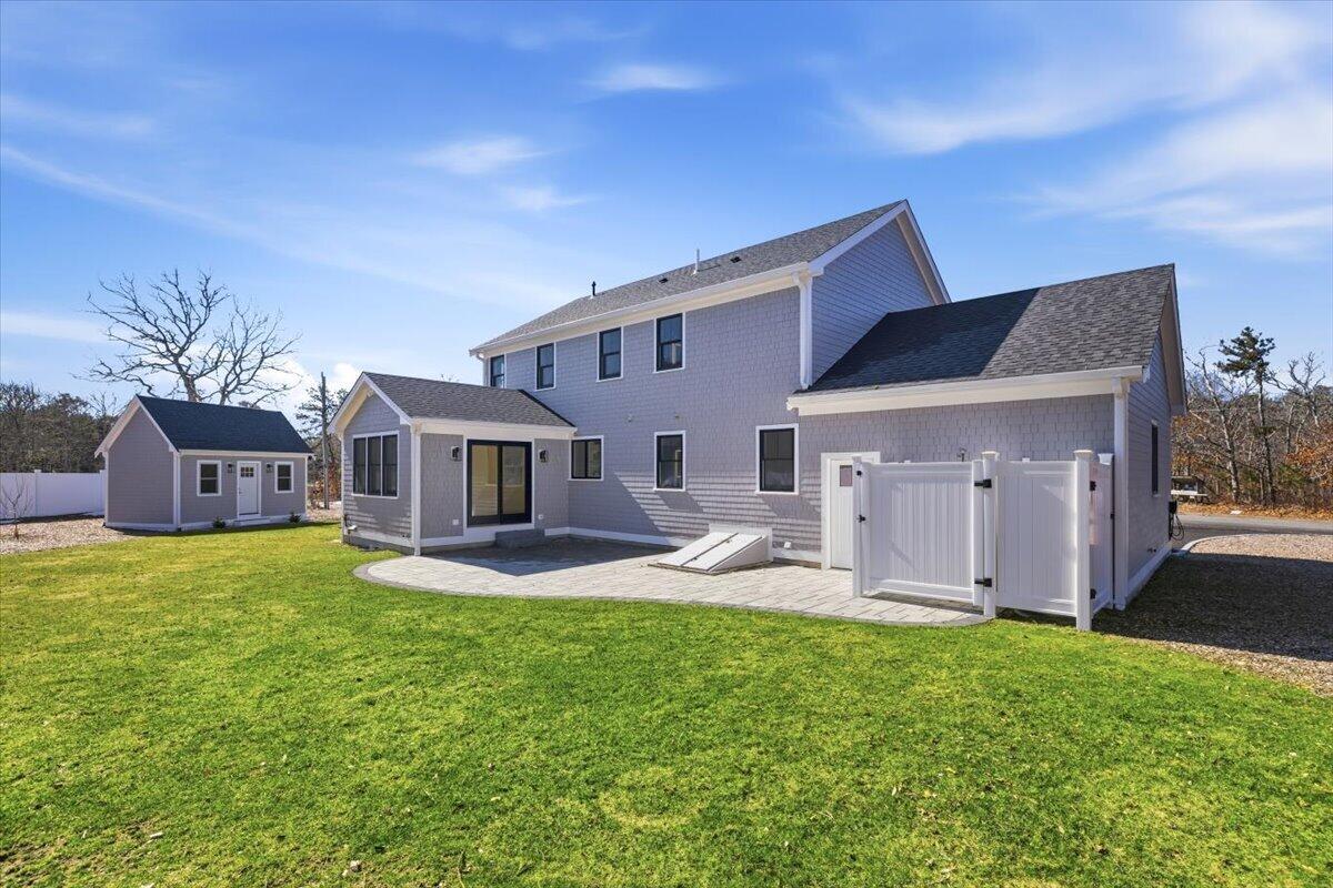 58 Old Chatham Road Brewster, MA 02631 - Photo 13 of 38 a house view with a sitting space and garden