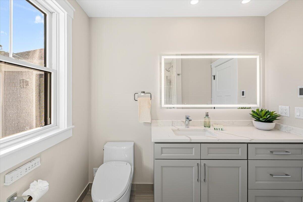 58 Old Chatham Road Brewster, MA 02631 - Photo 16 of 38 a bathroom with a toilet sink and mirror