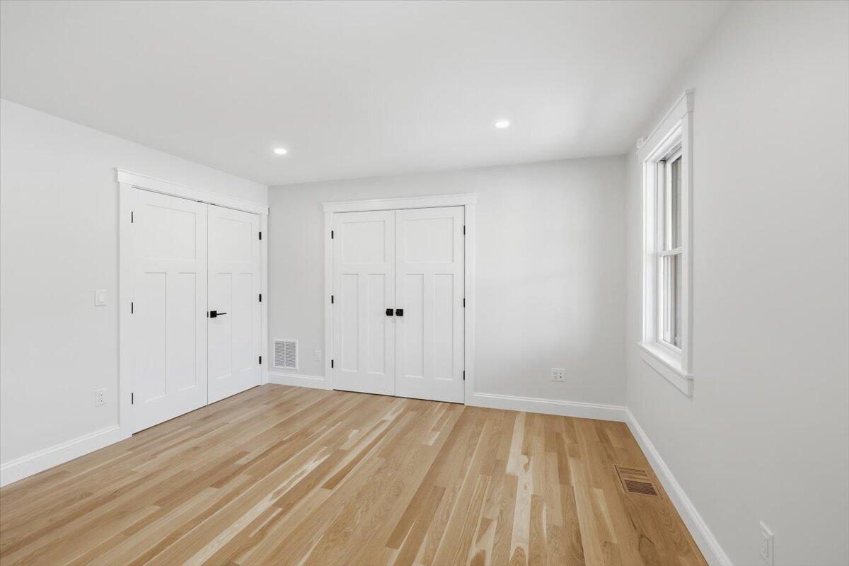 58 Old Chatham Road Brewster, MA 02631 - Photo 17 of 38 a view of empty room with wooden floor