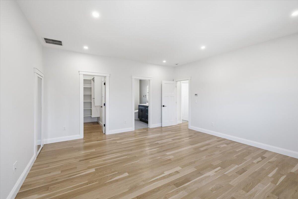 58 Old Chatham Road Brewster, MA 02631 - Photo 20 of 38 a view of an empty room with wooden floor