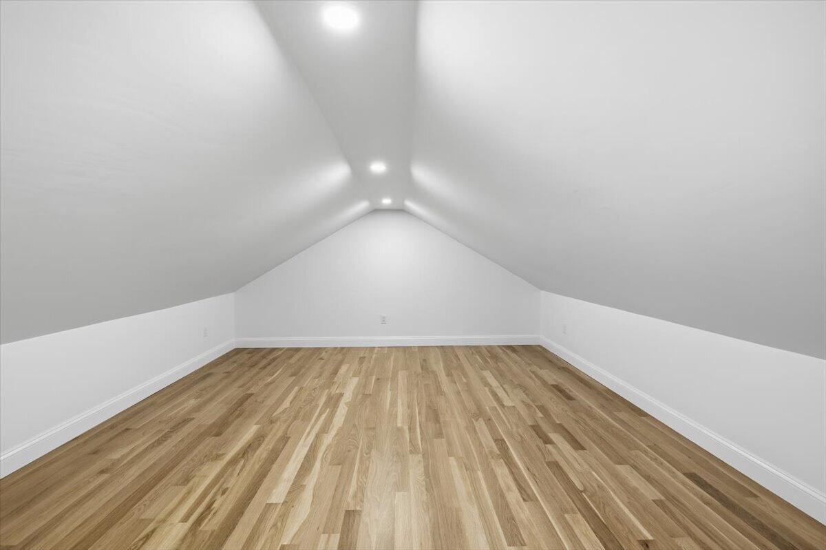 58 Old Chatham Road Brewster, MA 02631 - Photo 24 of 38 a view of an empty room with wooden floor